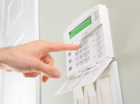 13237675 – pressing the code on a house alarm